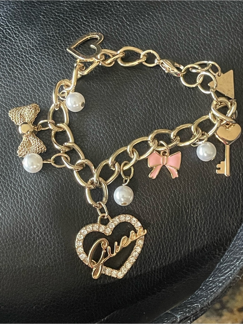 Guess Gold Tone Charm Bracelet with Pink Bow & Faux Pearls